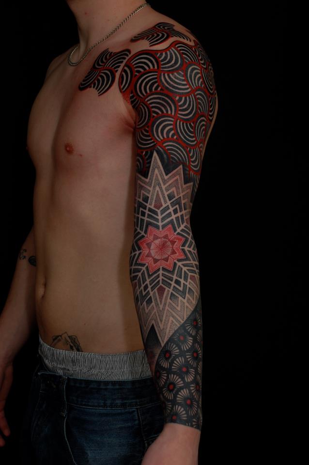 Geometric sleeve tattoo by Gerhard Wiesbeck