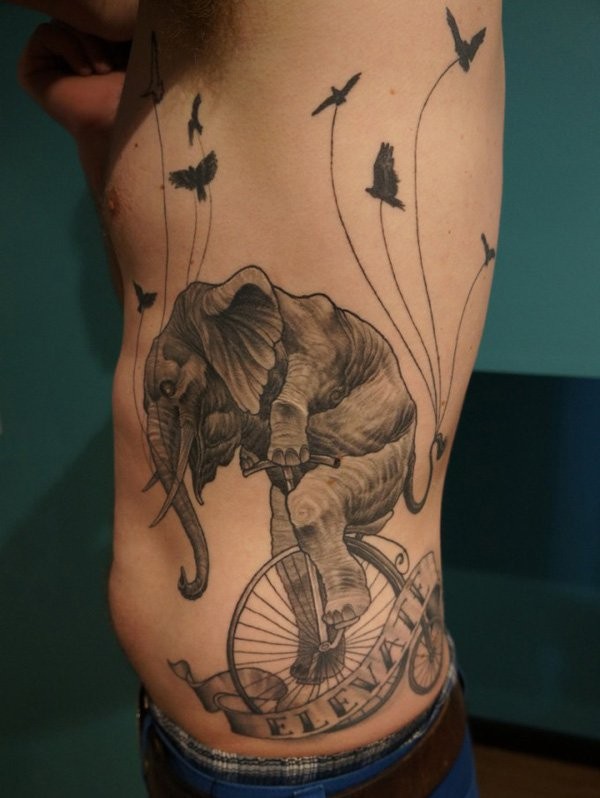 elephant biking tattoo